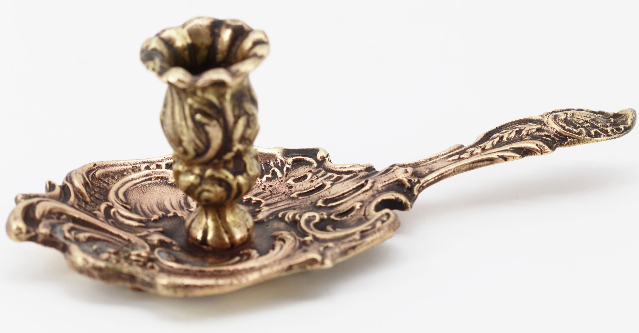 Old brass hand candle holder
