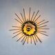 Spanish sunburst ceiling light – gilt iron rays & exposed bulb, 1960s