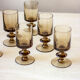 6 glasses in smoked glass foot