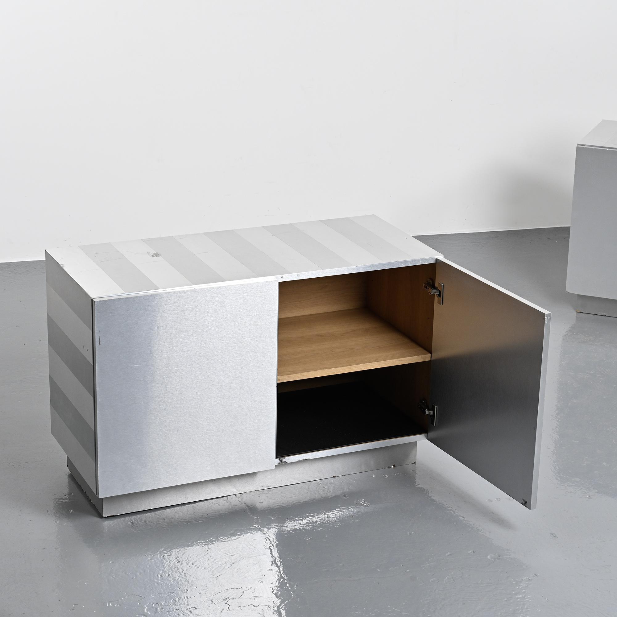 Pair of low buffets in brushed metal, French work, 1970s.