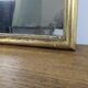 Antique gold mirror known as "gendarme's hat", patinated elegance 70 x 30 cm