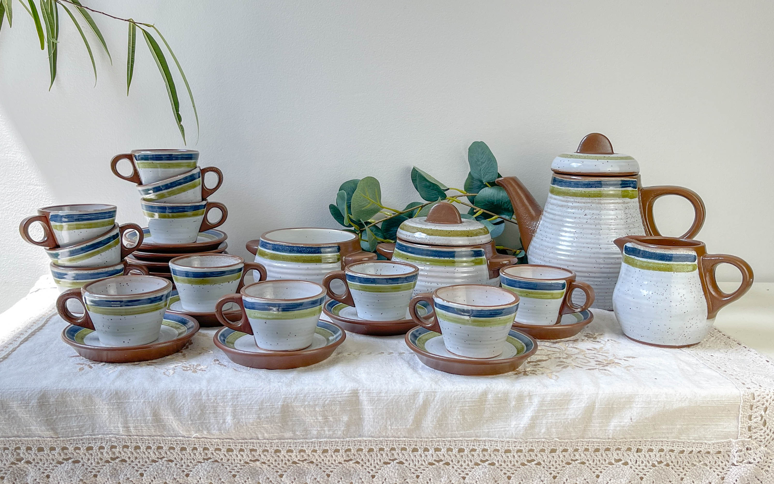 Vintage 1950s speckled stoneware coffee set with grey, green, and blue stripes