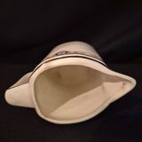 Vintage vase, geometric frieze and flowers with a black border.