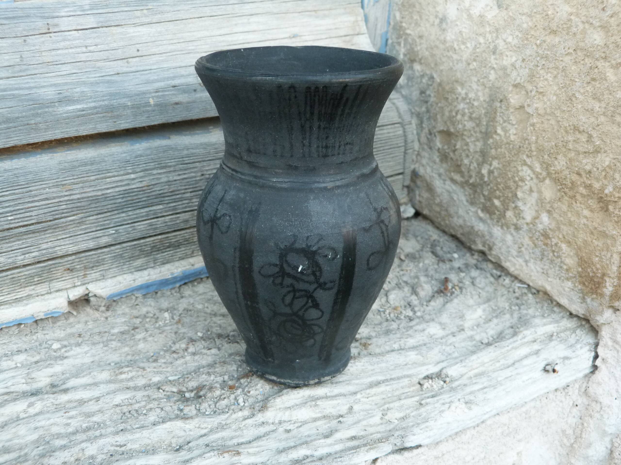 Pitcher in matte and glossy black pottery