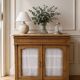 Antique wooden sideboard, fabric doors and pearl grey shelves.