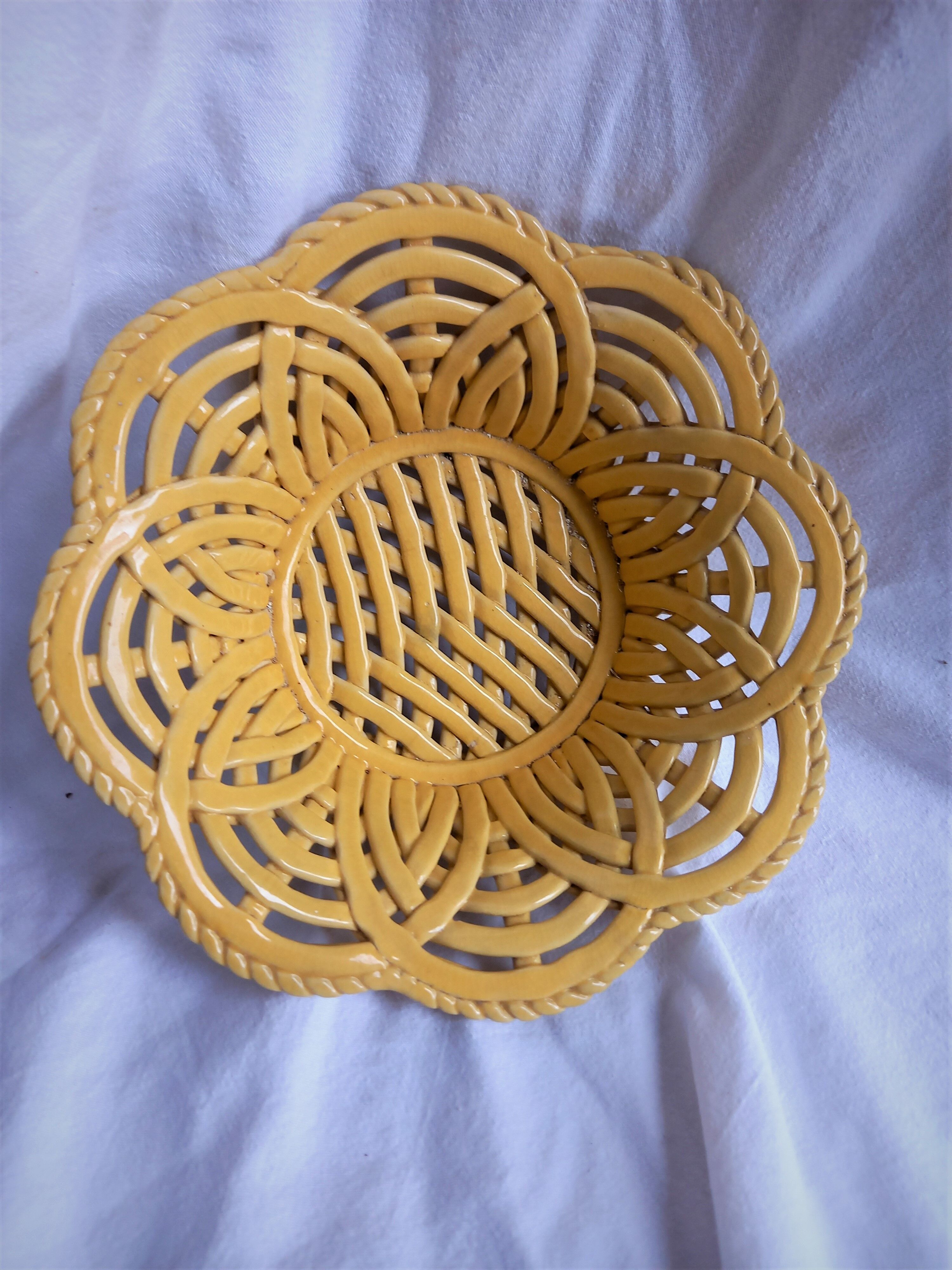 Yellow braided ceramic fruit basket