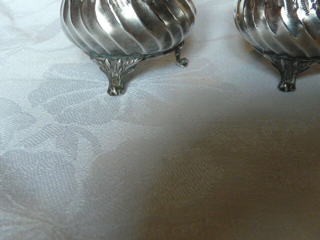 Pair of silver pepper shaker punch minerve