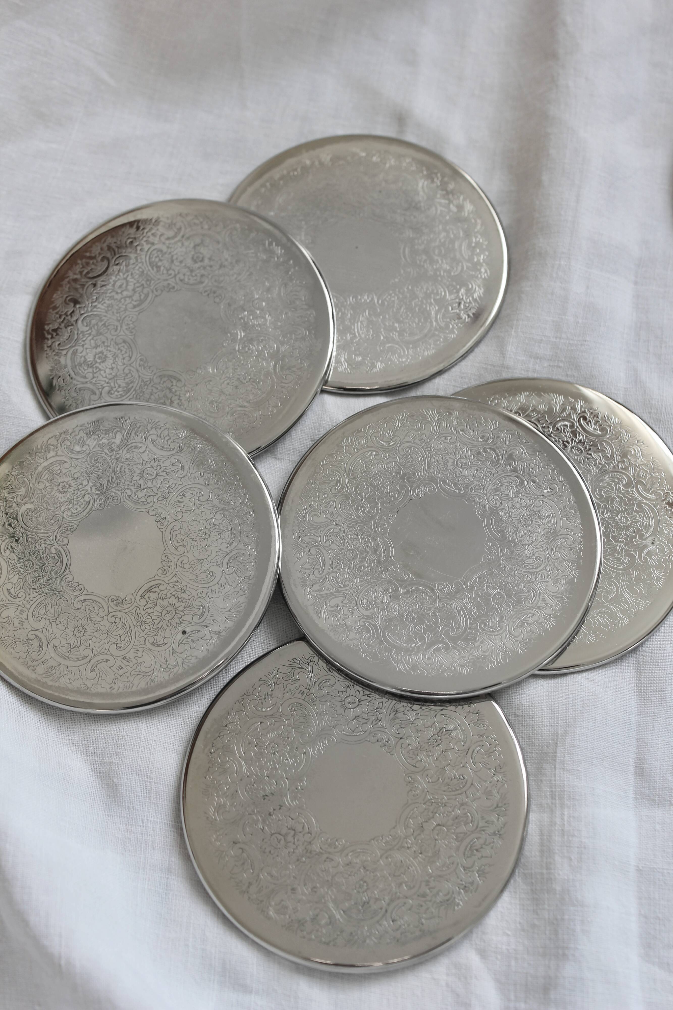 6 vintage chiseled silver metal coasters