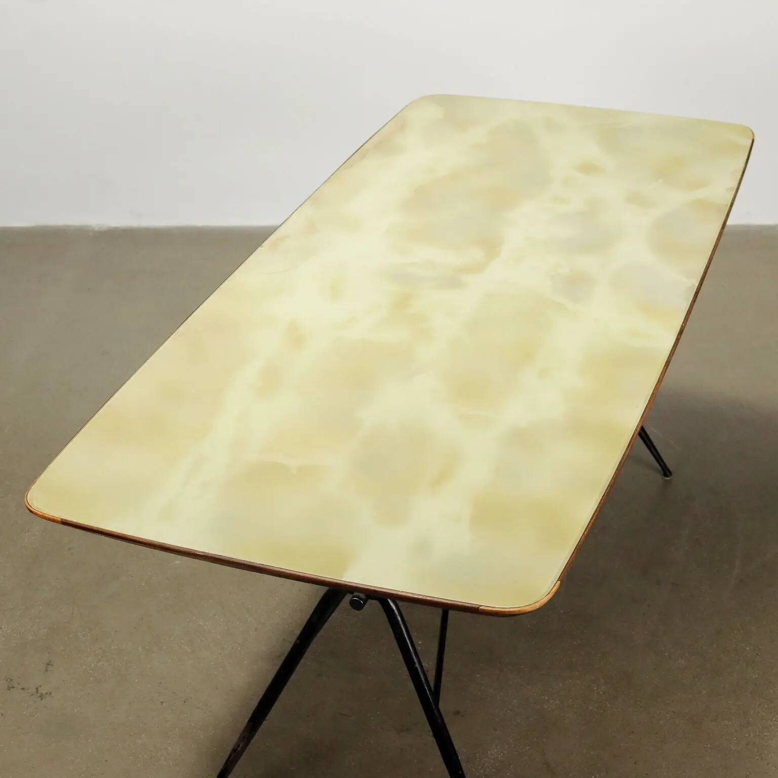 1960s vintage table made of wood and metal with a glass top, Italy.