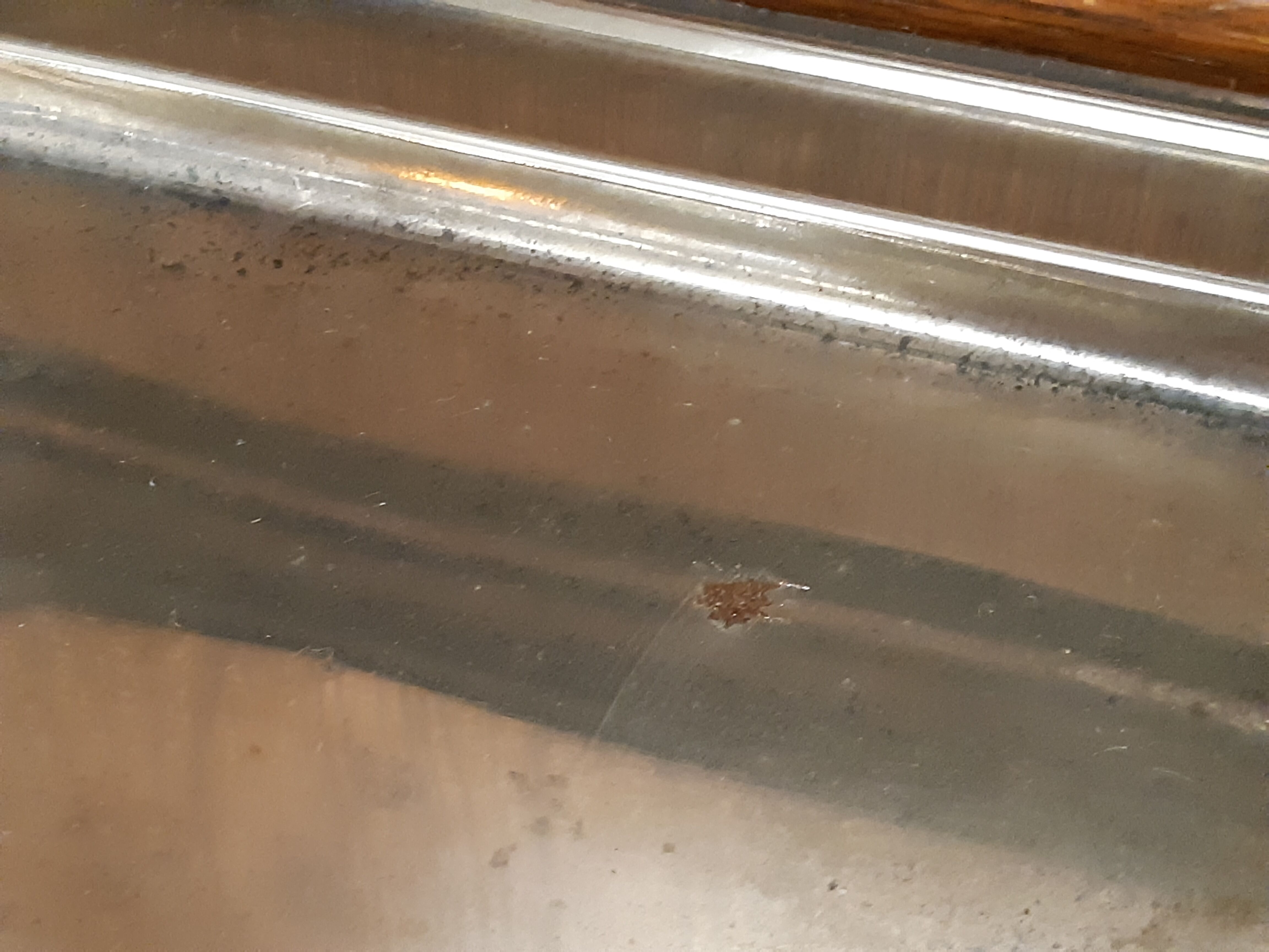 Silver dish with foie gras, duck heads