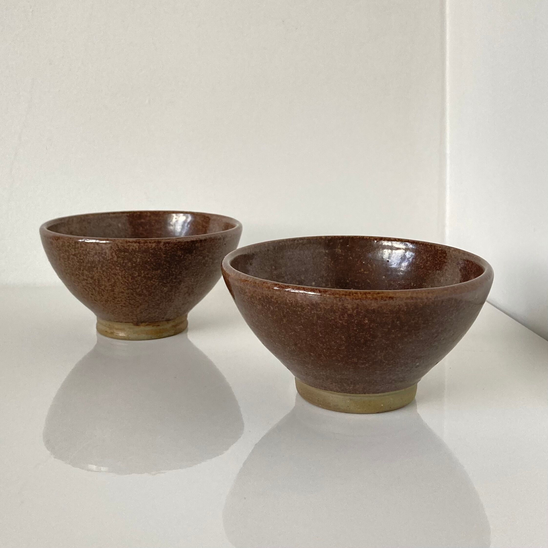 Pair of Japanese temoku bowls in brown glazed stoneware
