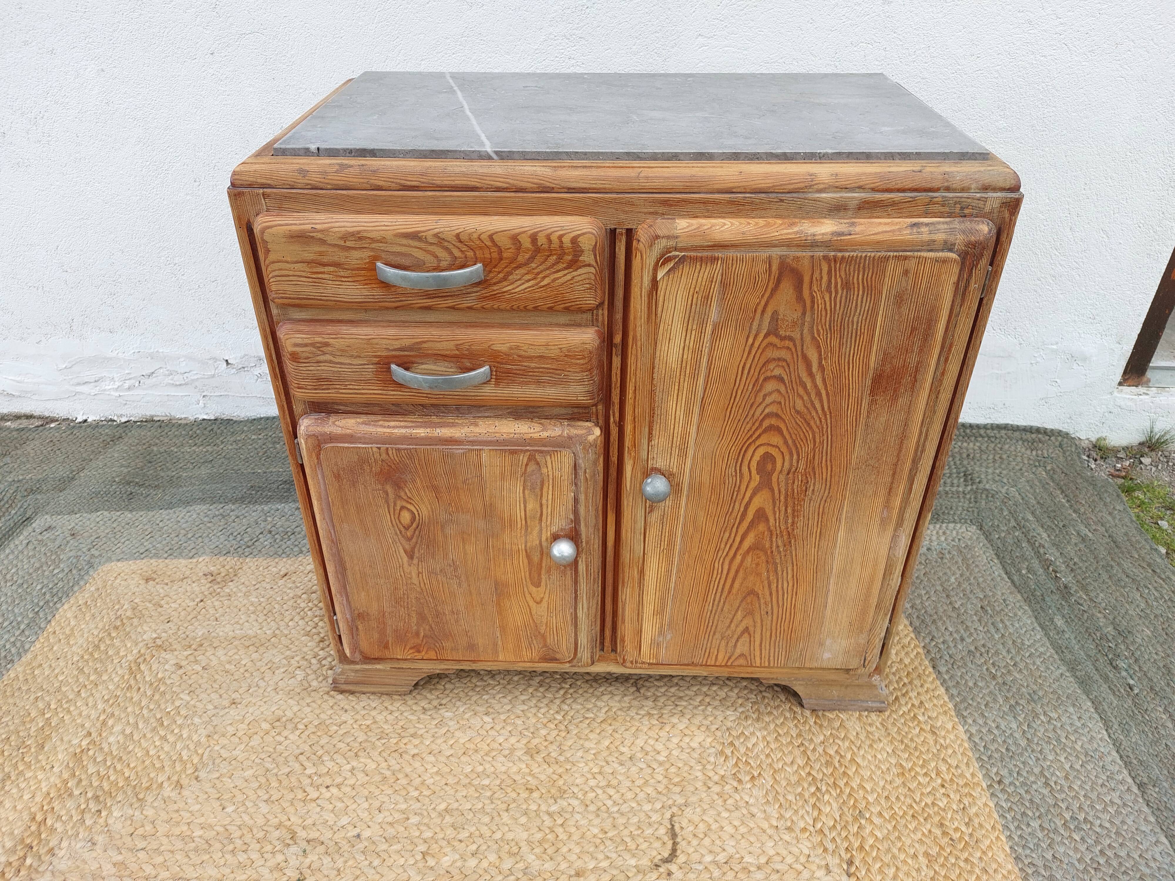 Vintage wooden buffet with a marble top.