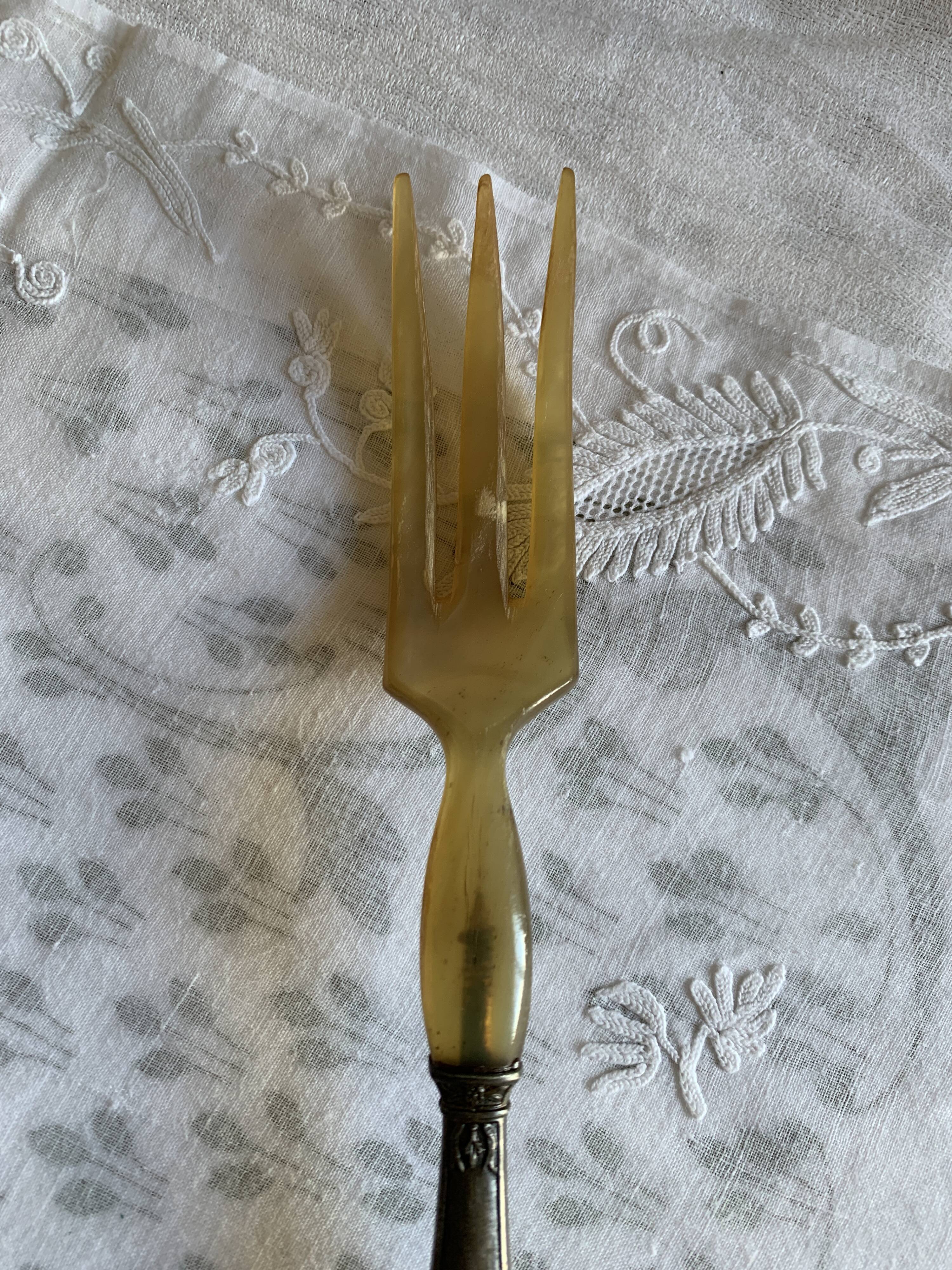 Horn and metal salad servers from the 1920s