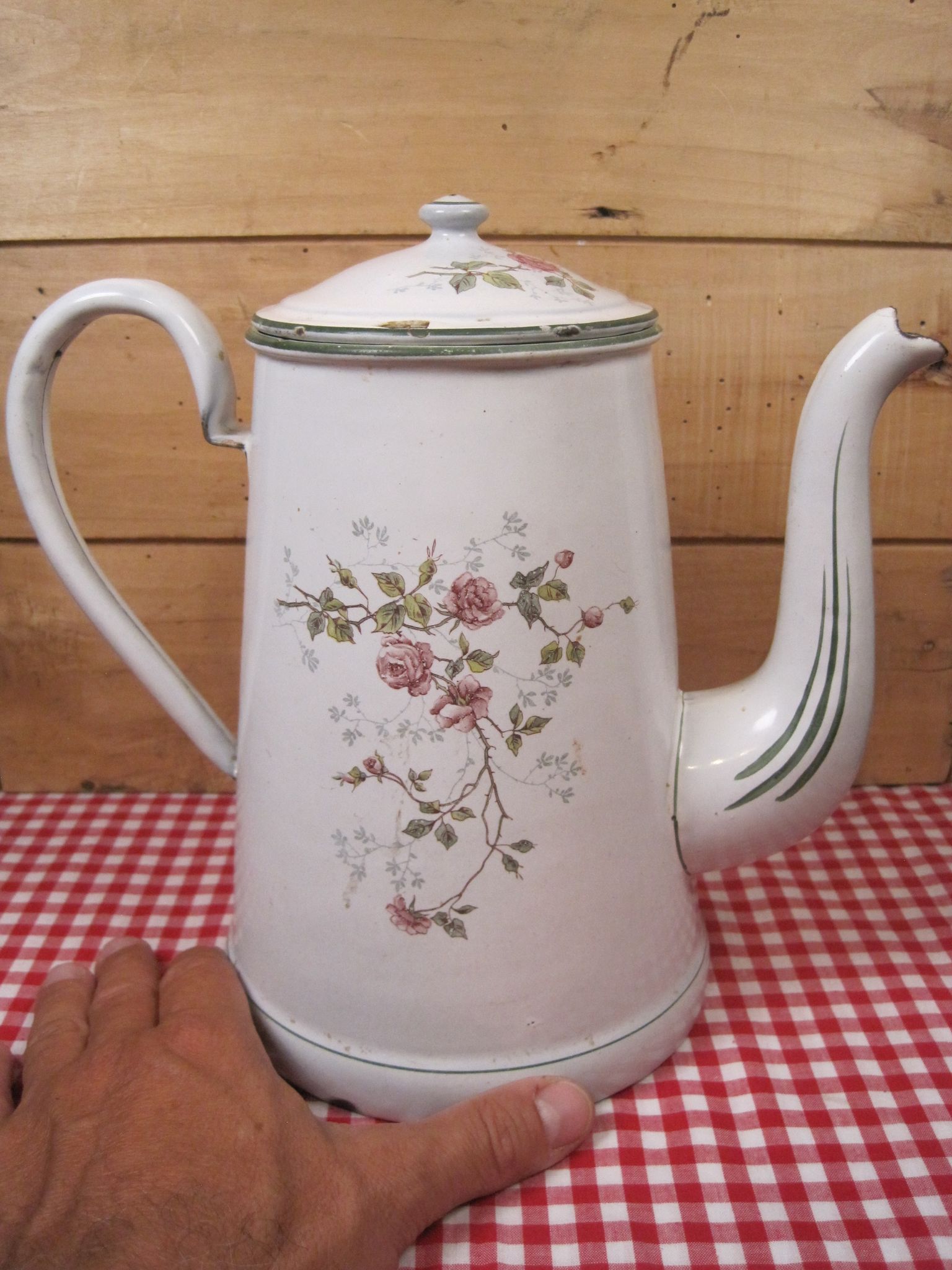 Old coffee maker in enamelled sheet metal brand bb 1900s , decoration of roses , kitchen utensils
