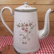 Old coffee maker in enamelled sheet metal brand bb 1900s , decoration of roses , kitchen utensils