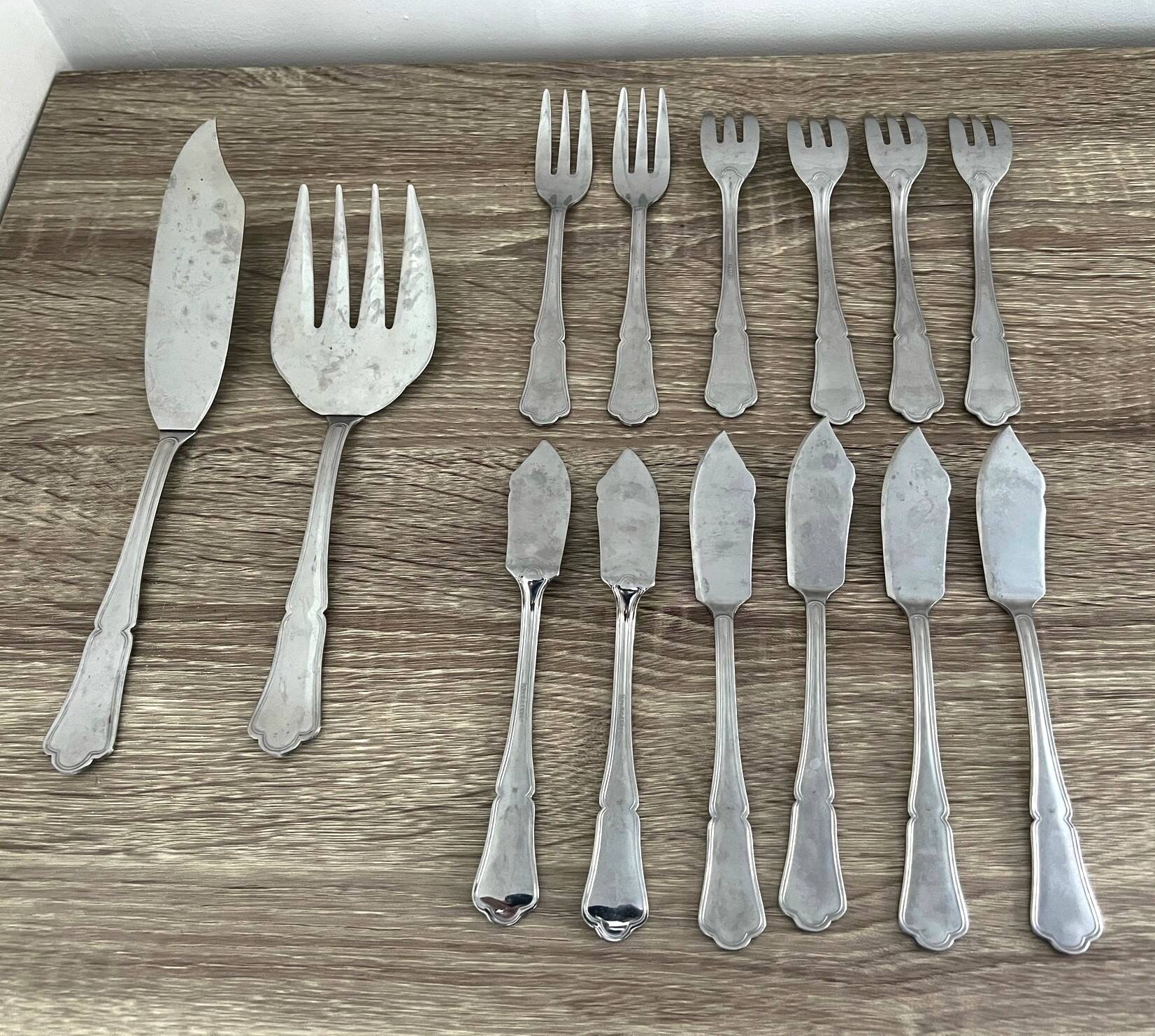 14 fish cutlery sets, 6 forks, 6 knives, 2 stainless steel serving cutlery sets