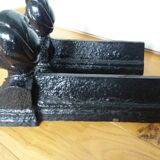 Cast iron andirons with character heads