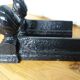 Cast iron andirons with character heads