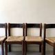 Lot of 4 modernist chairs in solid wood, leather and straw, Italy 1970.