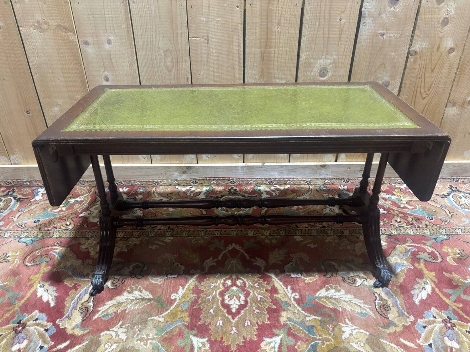 English Regency coffee table, mahogany & green stamped leather with gold.