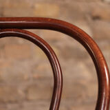 Curved wooden chair and tuna-