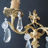 Pair of gilded bronze sconces and crystal pendants