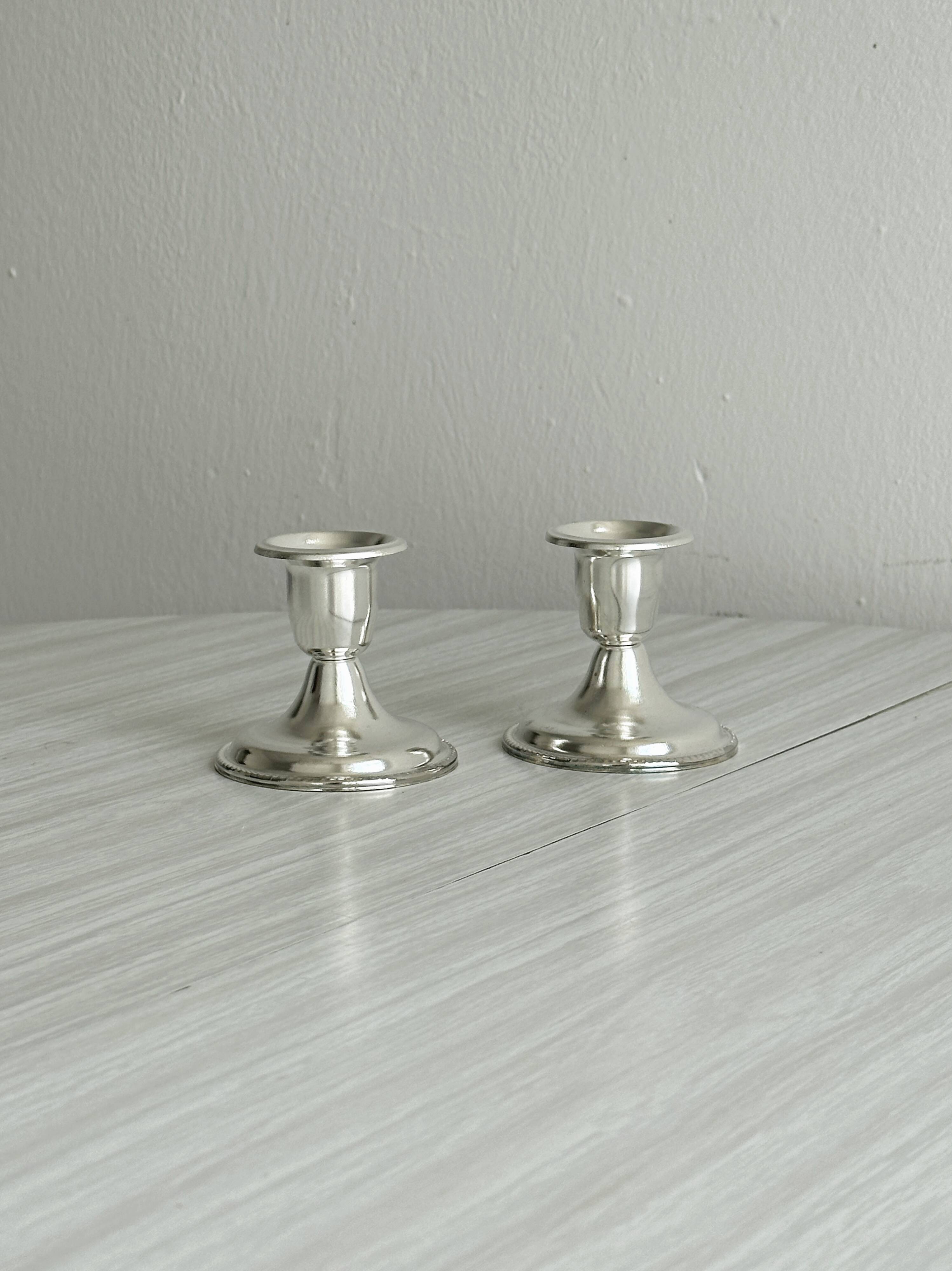 Pair of lightweight silver metal candlesticks