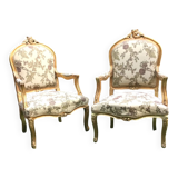 Pair of straight-backed armchairs, known as "queen's armchairs," in carved and gilded wood