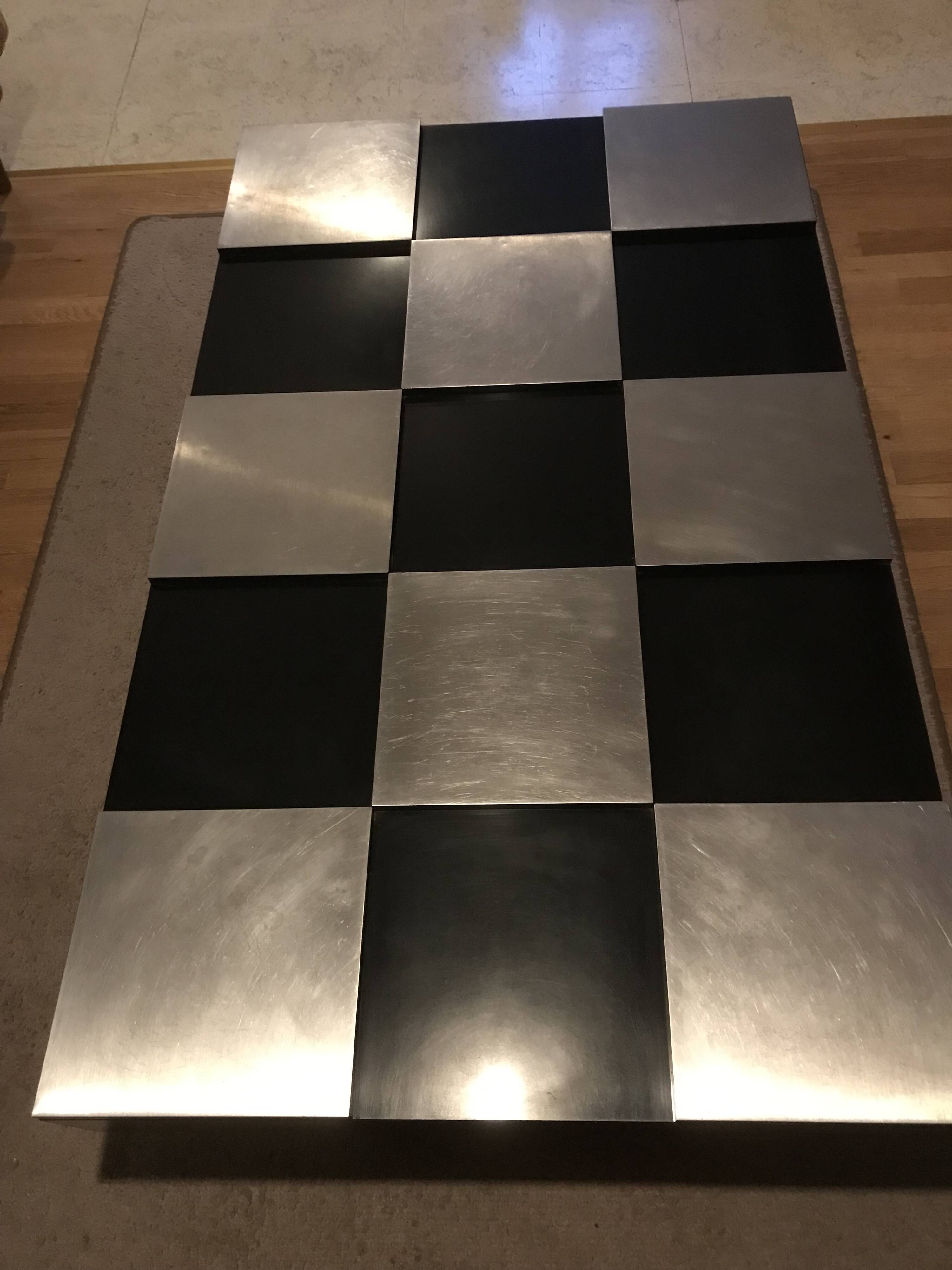 Coffee table with stainless steel checkered top and black formica