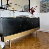 Black buffet cabinet including a bar and 3 drawers.