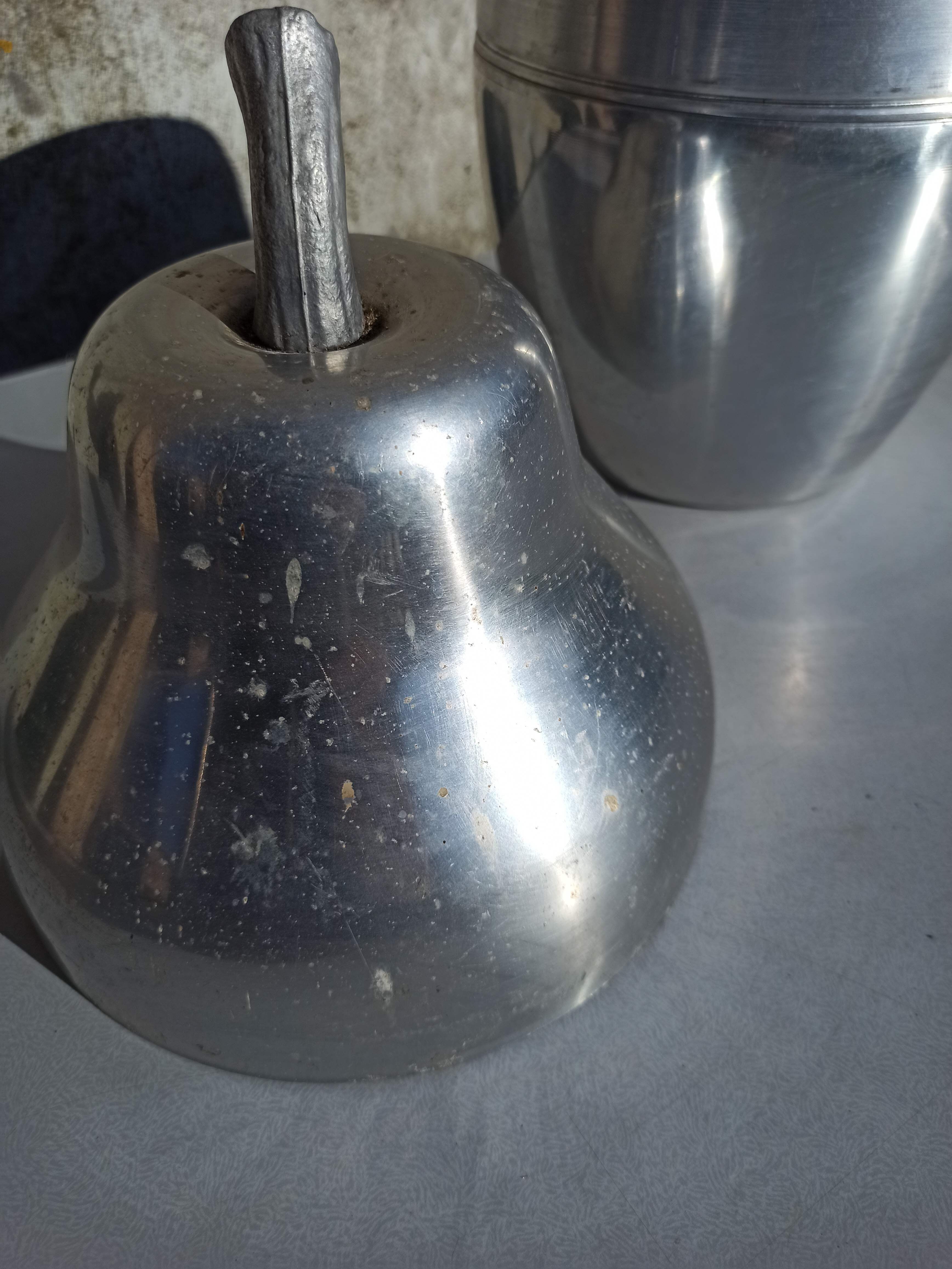 Old ice bucket ice cube in the shape of aluminum pear