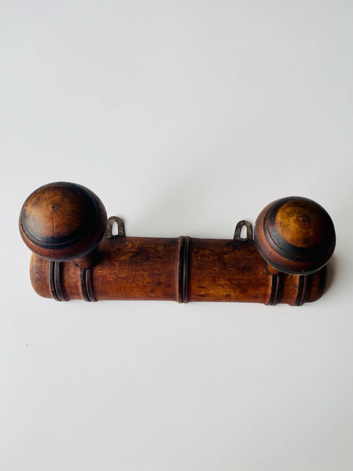 Wooden wall-mounted coat rack with two hooks