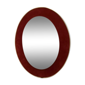 Antique oval mirror in garnet-burgundy velvet