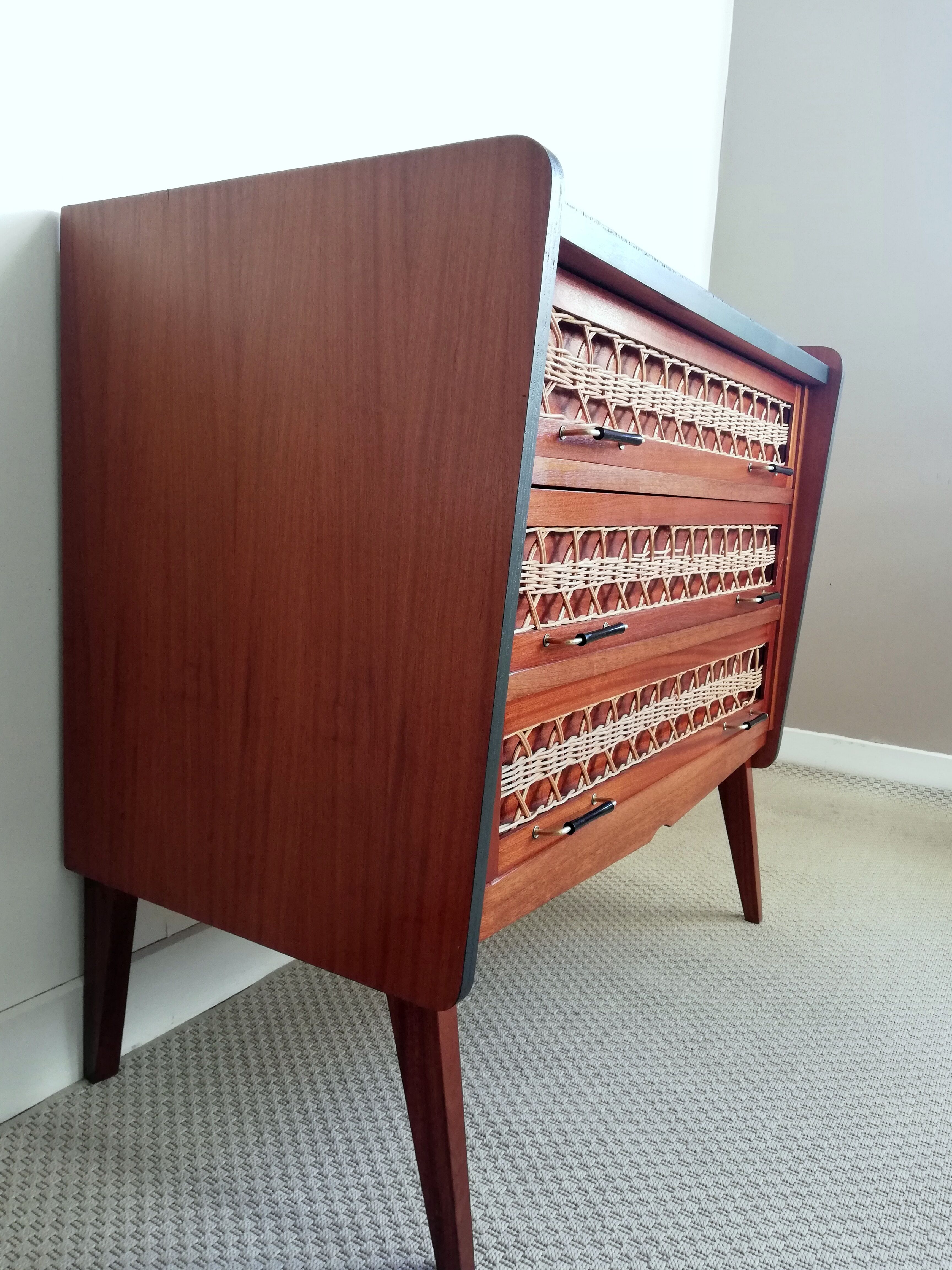 Teak and rattan chest of drawers feet compass