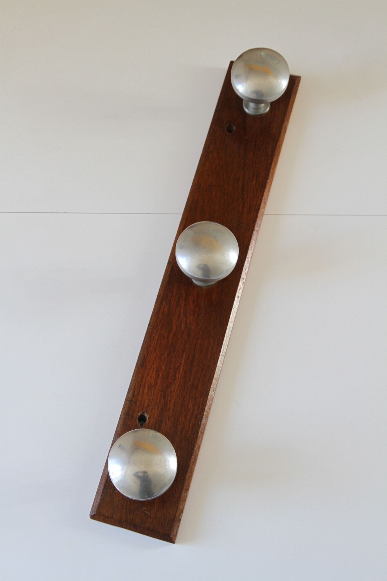 Wooden and stainless steel coat holders from the 1920s