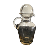 Vintage decanter made of blown glass paste