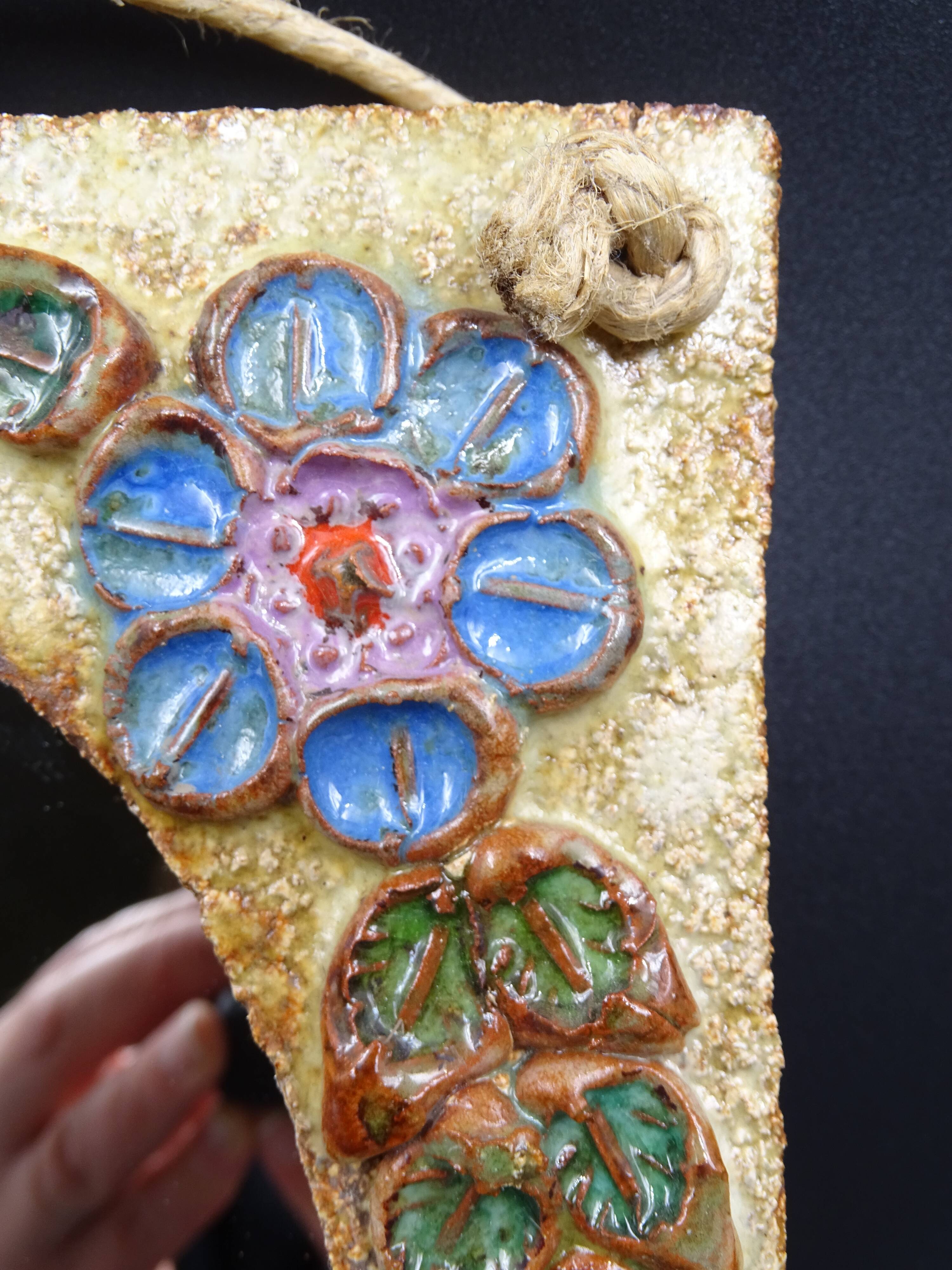Flower-decorated sandstone mirror, circa 1970