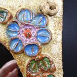 Flower-decorated sandstone mirror, circa 1970