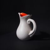 White and orange pitcher with organic curves