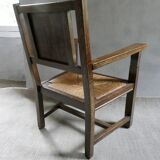 Armchair in carved solid wood with straw seat