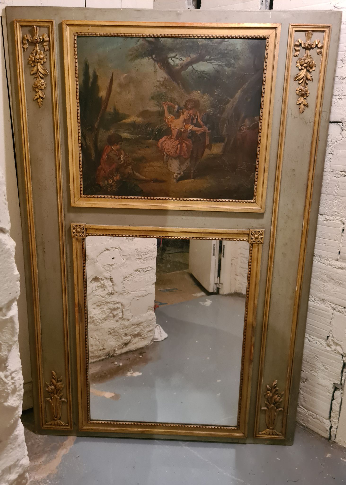 Lacquered wooden trumeau in the Louis XVI style, late 19th century.