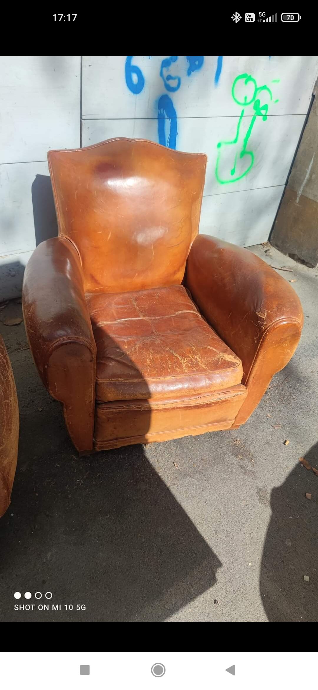 Pair of club chairs with moustache-shaped handles in Havana leather, in their original condition, circa 1930