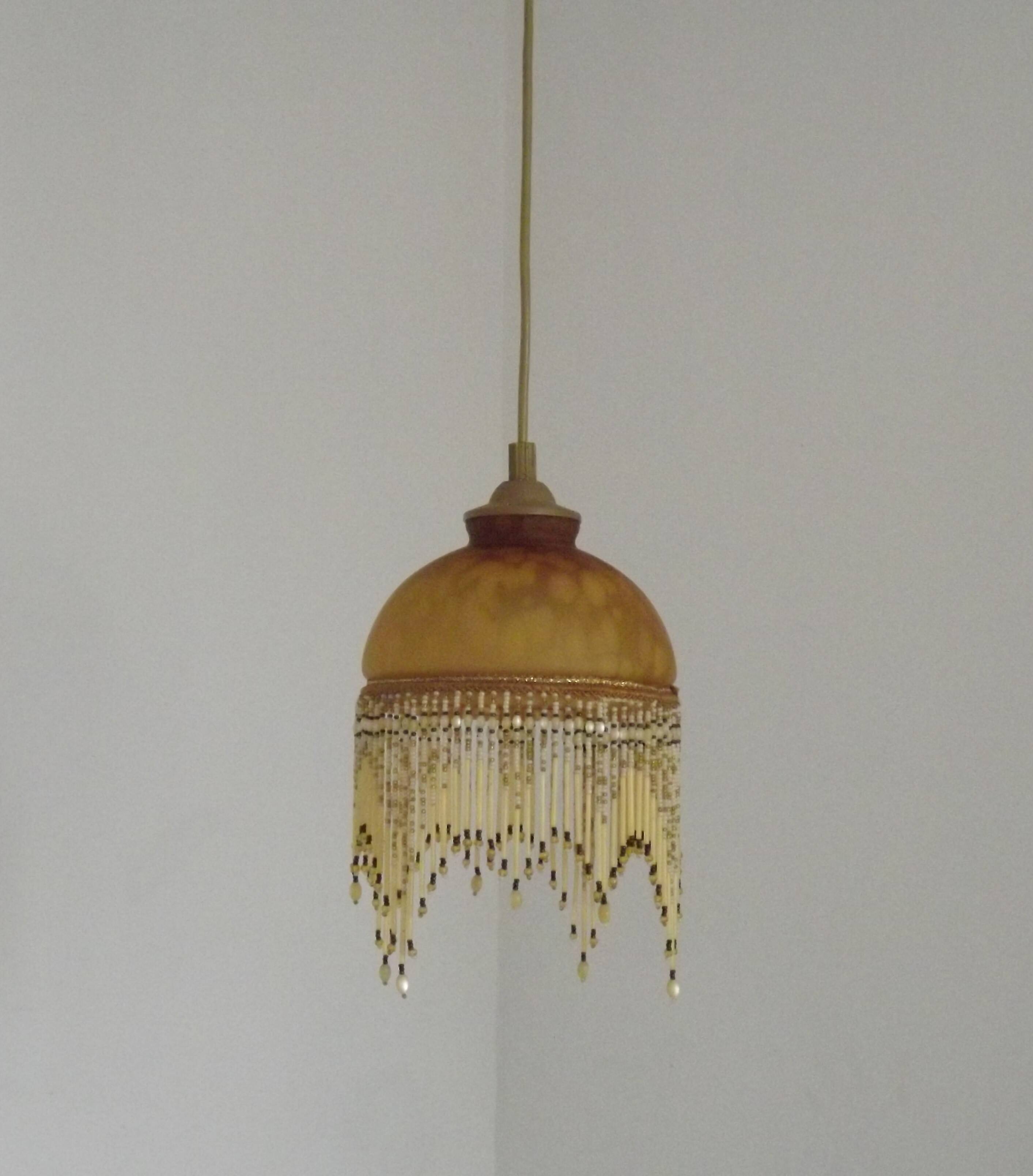 Vintage French amber mottled glass hanging ceiling light with beaded fringe.