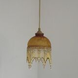 Vintage French amber mottled glass hanging ceiling light with beaded fringe.