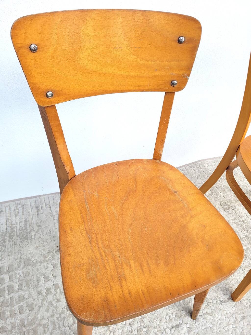 Pair of bistro chairs, one Thonet.