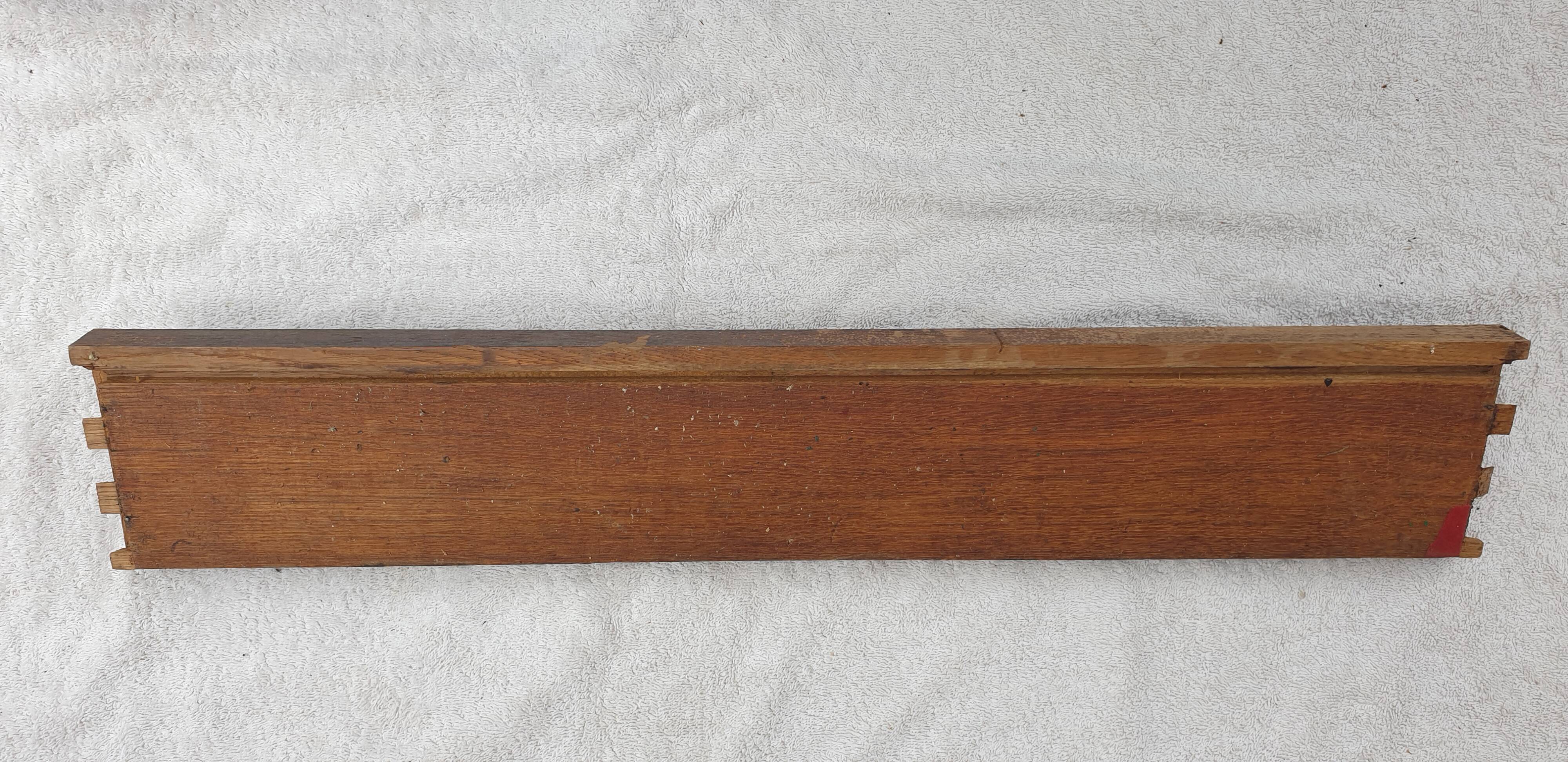 Natural wood pediment with bunches of grapes