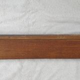 Natural wood pediment with bunches of grapes