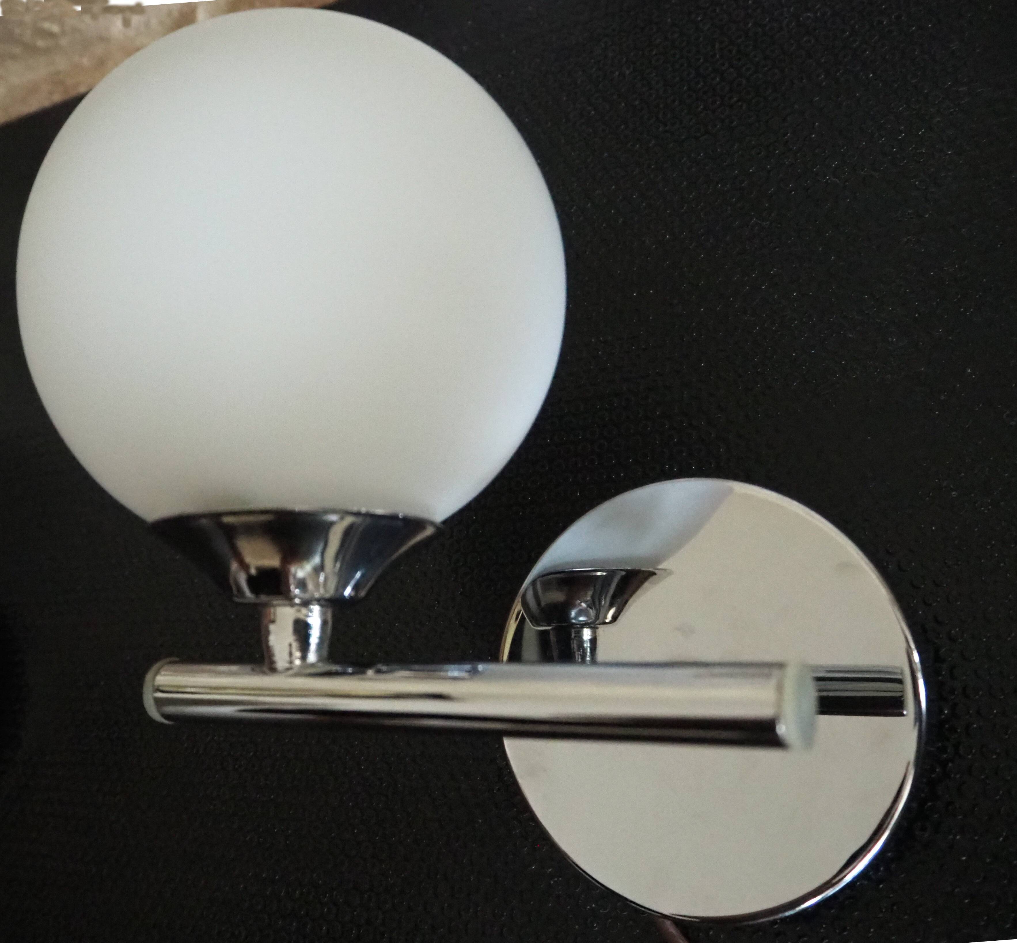 Pair of sconces with an opaline globe and chrome structure from the 1970s