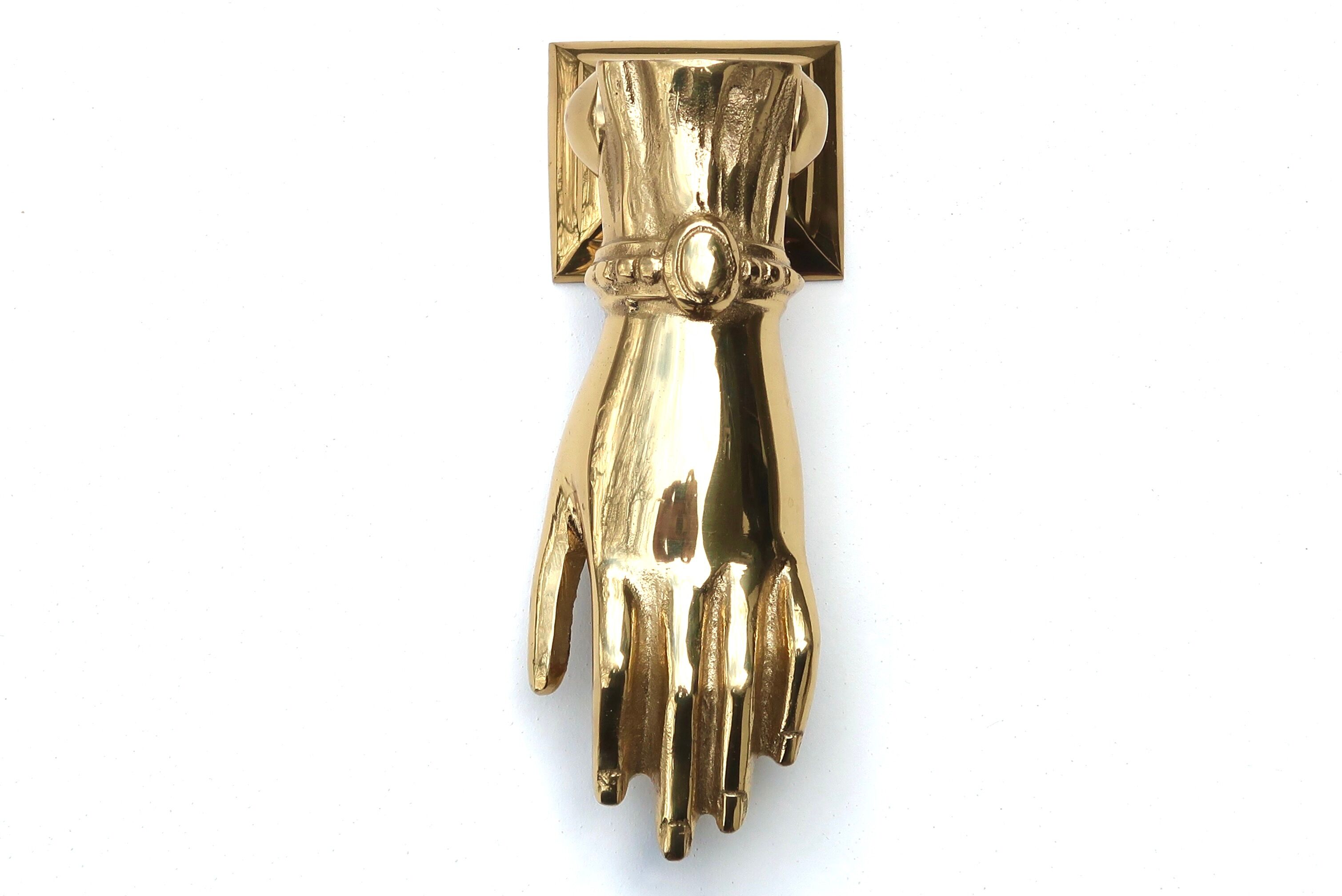 Brass hand-shaped door knocker, 1950s