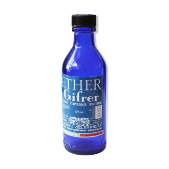 Blue glass bottle of ether